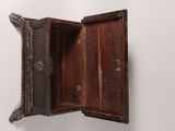a small wooden box with a door open