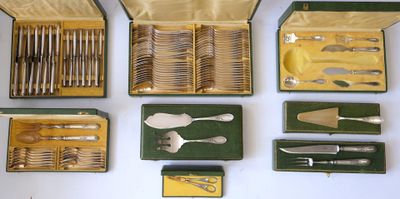 many different types of silverware in a case
