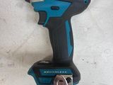 a close up of a cordless drill on a table