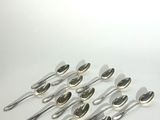 a lot of spoons that are sitting on a table