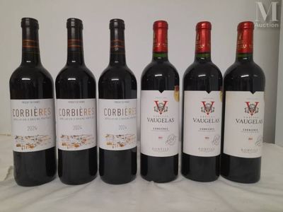six bottles of wine are lined up on a table