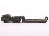 a toy army truck with a trailer attached to it