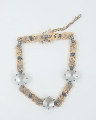 Bracelet en or jaune 750‰ et platine ornée de petits saphirs…