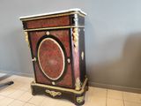 a cabinet that is sitting on the floor in a room