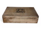 an antique silver box with a design on the lid