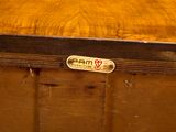 a close up of a wooden box with a label on it