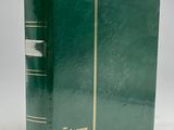 an old green book with a gold trim on the cover