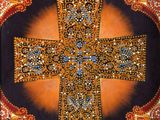 an image of a decorative cross is displayed on a wall