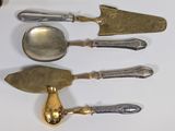 five different types of silverware on a white table