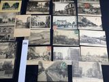 a lot of old black and white photos on the table