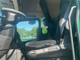 a picture of a truck with the door open and the driver ' s seat down