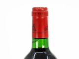 a bottle of wine that is sitting on a table