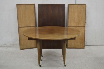 a wooden table with two chairs around it