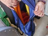 a woman that is holding a blue bag in her hand