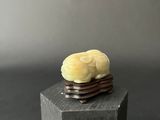 a small piece of food on top of a wooden block