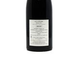 a bottle of wine that is sitting on a table