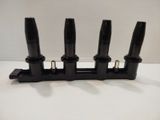 a black holder that has four black candles on it