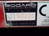 a close up of a license plate on a red car