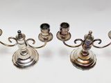 two silver plated candlesticks on a white background