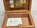 a wooden box with a clock inside of it
