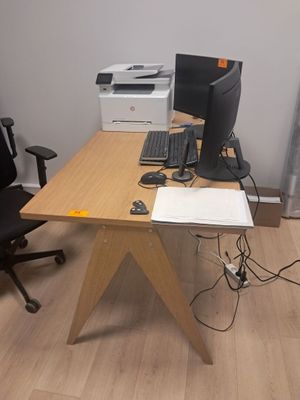 a desk with a computer and a printer on it