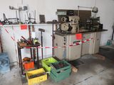 a room that has a bunch of tools on the shelves