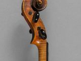 an old violin with a wooden back and neck