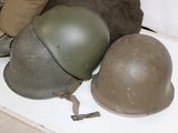 three helmets sitting on a table next to each other