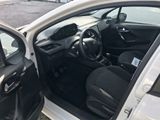 a white car with its door open next to a white car