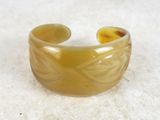 bracelet made of glass with a design on the inside of it