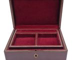 an image of a brown leather box with four compartments