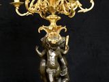 pair of antique brass candelabs with cherenshes on pedestal