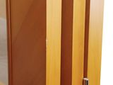 a close up of a wooden door with a glass door