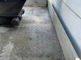a dump truck that is parked on the side of the road