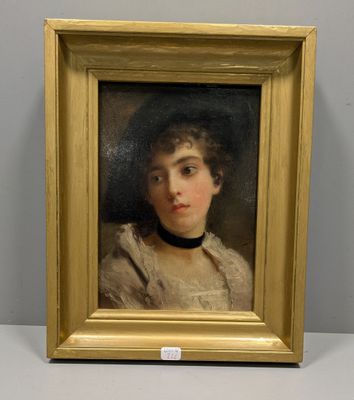 portrait of a young woman in a white dress by a gold frame