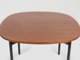 a round wooden table with black legs and a wooden top