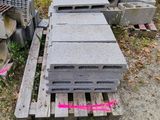 a pile of concrete blocks sitting on the ground