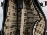 a black purse with a zipper on the inside of it