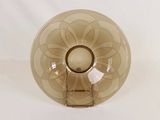 a brown glass bowl with a flower design on it