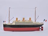 a model of a large boat on a white surface