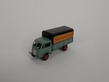 a toy truck that is sitting on a white surface