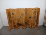 an image of a room divider with birds and plants painted on it