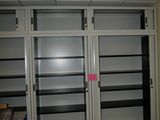 a room with a bunch of shelves in it