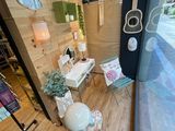 a bathroom with a toilet, sink, mirror, and a window