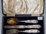 a silverware set in a box with a spoon and fork