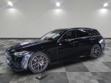 une Mercedes GLE noire garée dans un garage au sol carrelé