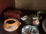 a shelf that has a lot of glass items on it