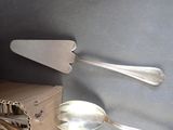 two spoons and a spatula sitting on a table