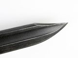 a knife that is laying on a white surface