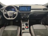 the interior of a car with a steering wheel, dashboard, and dashboard controls